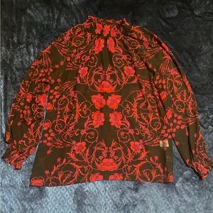 Eva Mendes red and black sheer blouse